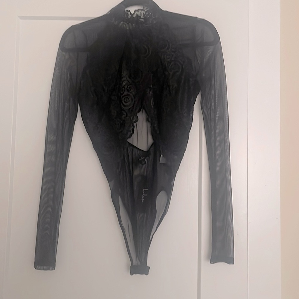 Black lace body suit with a wrapped lace neck